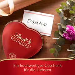 Lindt Schokolade von Herzen | 30 g | 6 Pralinen in Marc de Champagne, Coeur à l'Orange, knuspriger Milchschokolade, Orangen-Marzipan in einer wunderschönen herzförmigen Schachtel | Geschenk aus Schokolade | Schokoladengeschenk