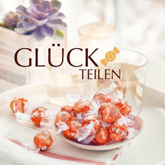 Lindt LINDOR Rot-Orangen-Schokoladenkugeln | 1 kg wiederverschließbarer Beutel | ca. 80 Pralinen mit zartschmelzender Füllung | Großpackung, Schokoladengeschenk