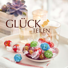 Lindt-Schokolade | Sortierte Tasche LINDOR silber | 1 kg Beutel | 80 zartschmelzende Milchschokoladenkugeln, 70 %, gesalzener Karamell und doppelter Schokoladengeschmack | Schenken Sie Schokolade zum Teilen