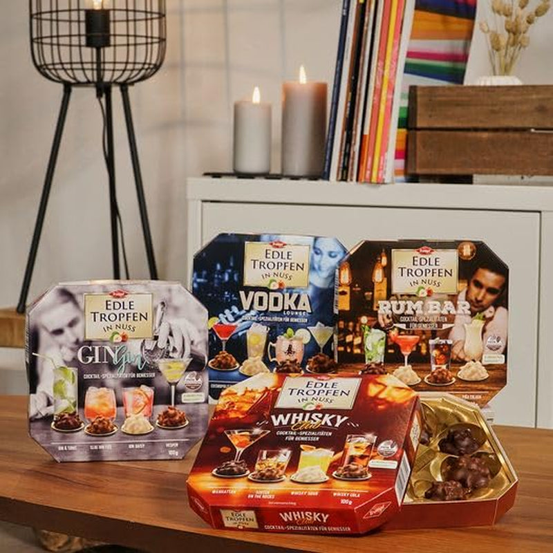 Edle Tropfen in Nuss Vodka Lounge 100g, flüssig gefüllte Schokoladenpralinen mit Milchschokoladenglasur und knackigen Haselnussstückchen