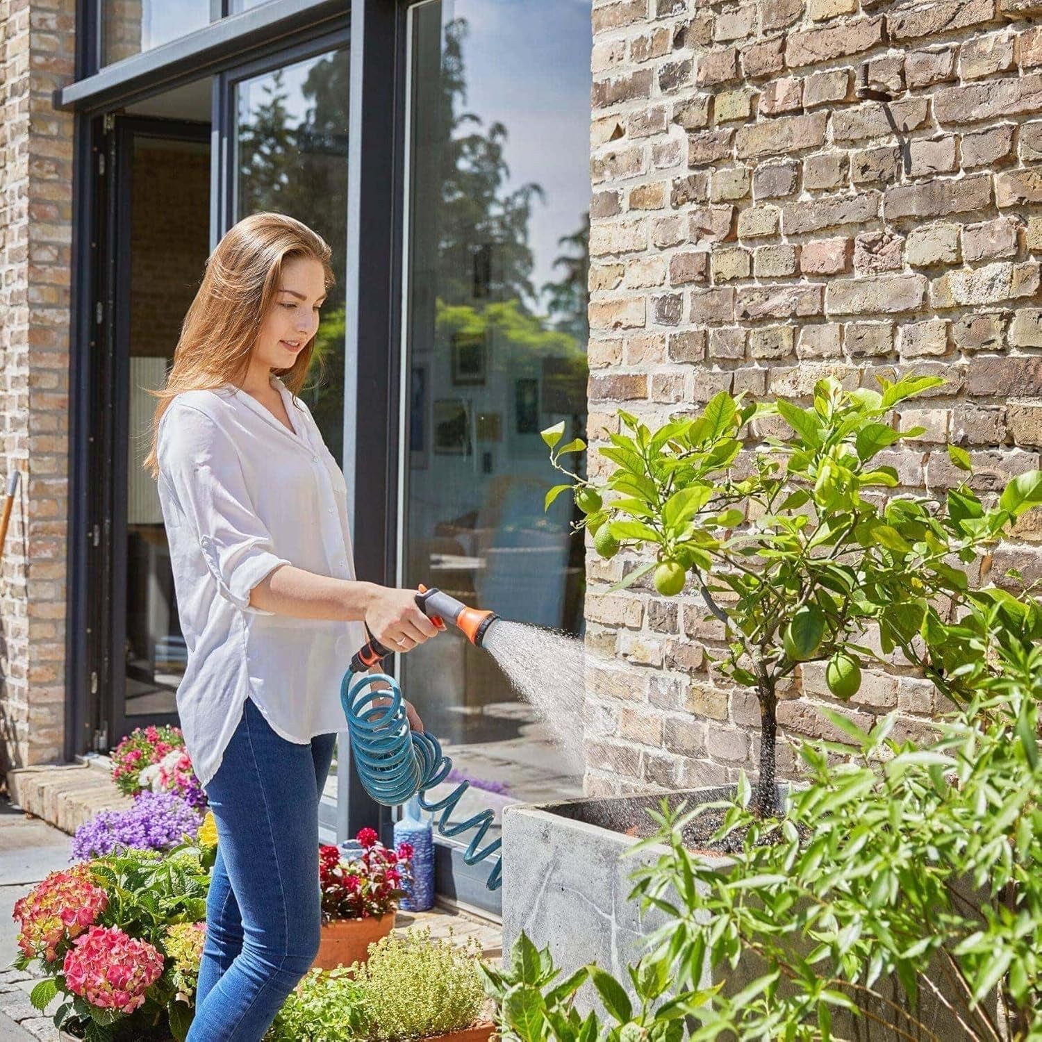 Set complet furtun spiralat Gardena 4647-20, cu retragere automată a furtunului, cu duză de pulverizare și racord robinet (lungime furtun: 10 m, diametru furtun: 9 mm, set: da)