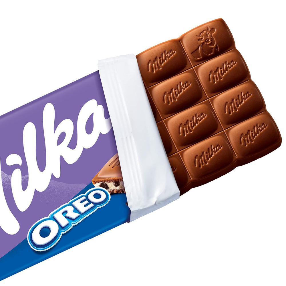 Milka Oreo – Alpenmilchschokolade gefüllt mit knusprigen Oreo-Keksstückchen und zarter Vanillecreme – 100g