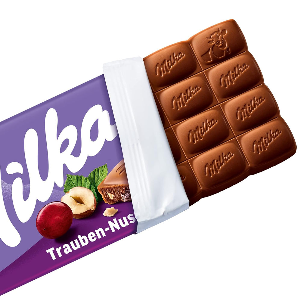 Milka Trauben und Haselnüsse – Alpenmilchschokolade mit Haselnuss- und Rosinenstückchen – 90g