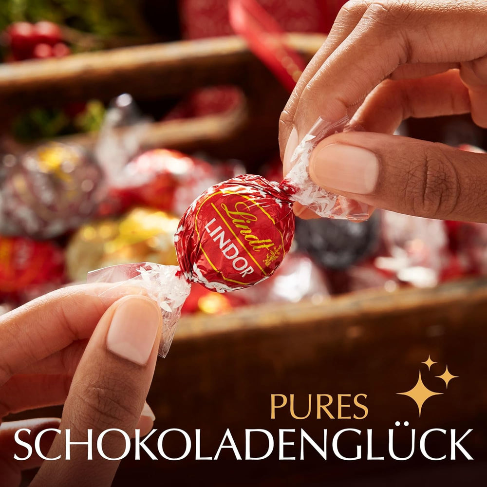 Lindt-Schokolade | Milchschokoladentüte LINDOR | 500g | 38 Milchschokoladenkugeln mit zartschmelzender Füllung | Schokoladengeschenk