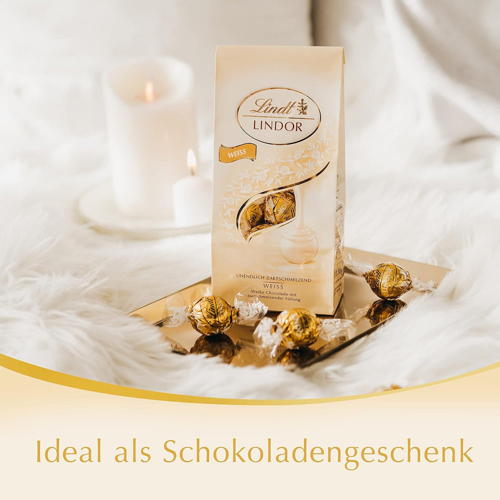 Lindt weiße Schokoladenkugeln LINDOR | 137g Beutel | Ca. 10 weiße Schokokugeln mit zartschmelzender Füllung | Geschenk aus Schokolade | Schokoladengeschenk