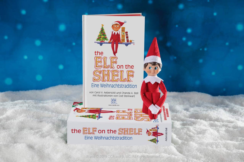 The Elf on the Shelf® Eine Weihnachtstradition | Junge mit blauen Augen | inkl. Zauberhaft illustriertes Buch, Erinnerungsbox & offizieller Adoptionsurkunde